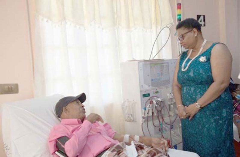 Mnister of Public Health, Volda Lawrence, speaking with a dialysis patient at the Regional Dialysis Centre in New Amsterdam