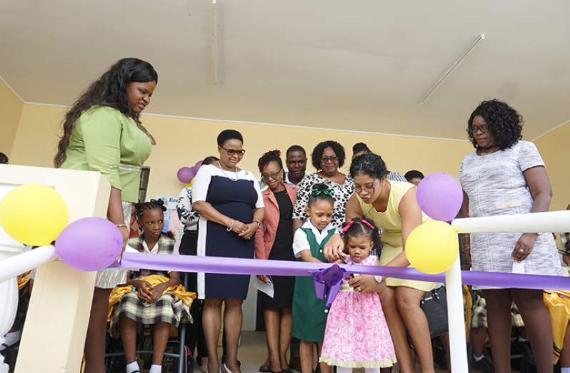 Minister of Public Health Volda Lawrence joined officials of the Region Four RDC, health officials, staff of the Eccles Health Centre and students to cut the ceremonial ribbon as part of the commissioning of the health centre (Carl Croker photo)