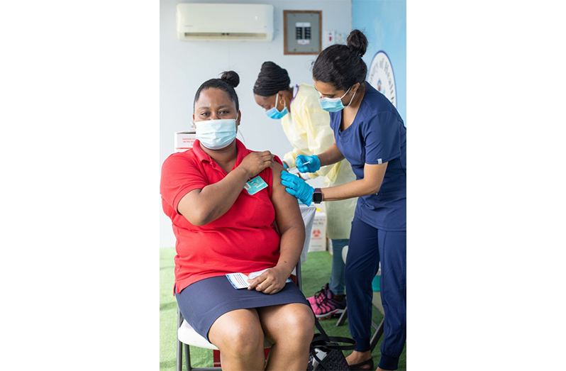 A female patient being attended to by a nurse
