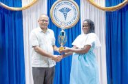 Minister of Health, Dr. Frank Anthony, presented the Valedictorian Trophy to Michelle Boyer in recognition of her outstanding performance during the Patient Care Assistant training programme
