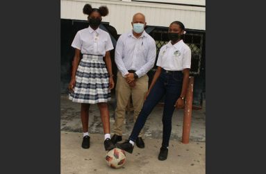 Henry Chase, Director and Principal of Chase Academic Foundation (centre) along with the two scholarship awardees