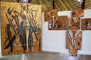 A section of her booth with two mixed media works of art