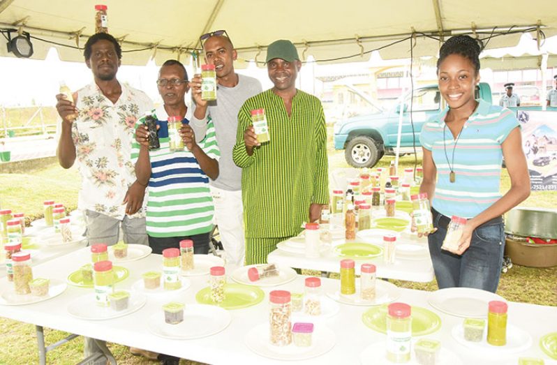 The herbalist, Dr. Da Silva (second left) and some of his affiliates at the recent RACE expo (Adrian Narine photo)