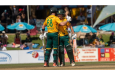 Jordan Hermann celebrates his 50 with Connor Esterhuizen  •  Cricket Namibia