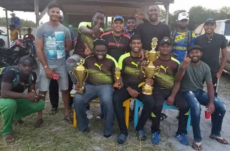 Herstelling players pose with their spoils after the final.