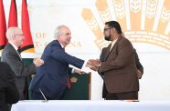 President, Dr Irfaan Ali (right) and John Hess (second from left) during the signing ceremony of the partnership in 2022 (Guyana Chronicle file photo)