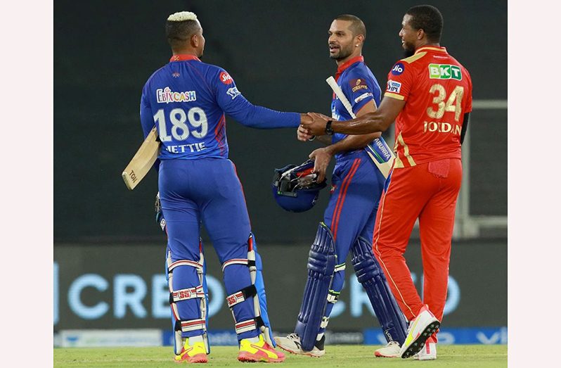 Punjab Kings Chris Jordan congratulates Shikar Dhawan and Shimron Hetmyer after Delhi Capitals comprehensive win.