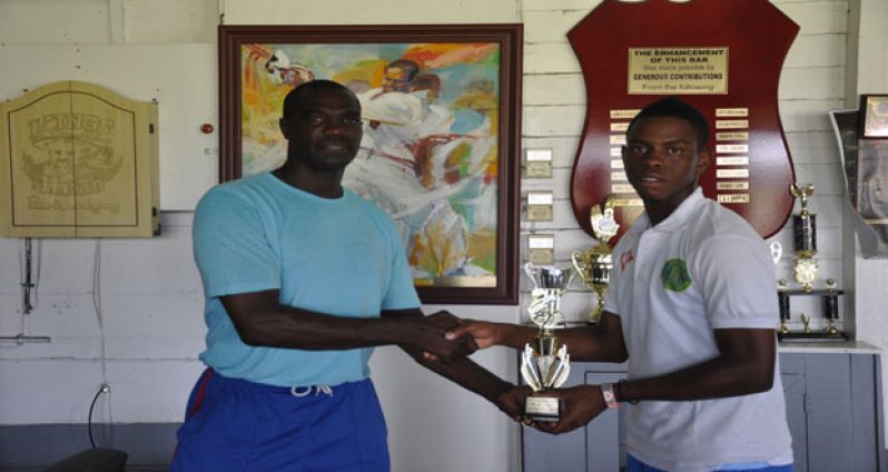 Congrats Hetty! Man-of-the-match and Berbice skipper Shimron Hetmyer is all smiles as he accepts his spoils from Match Referee Reon King.