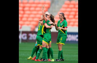 FLASHBACK! Alison Heydorn is swarmed by her teammates after scoring Guyana’s winning goal against Guatemala at the CONCACAF Olympic Qualifiers tournament in Houston, Texas last year.