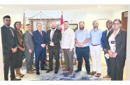 High Commissioner Sébastien Sigouin (in white shirt jack) surrounded by some members of the delegation and from left, the High Commission`s Trade Commissioner, Omesh Balmacoon and Senior Trade Commissioner, Yvanna Nganou