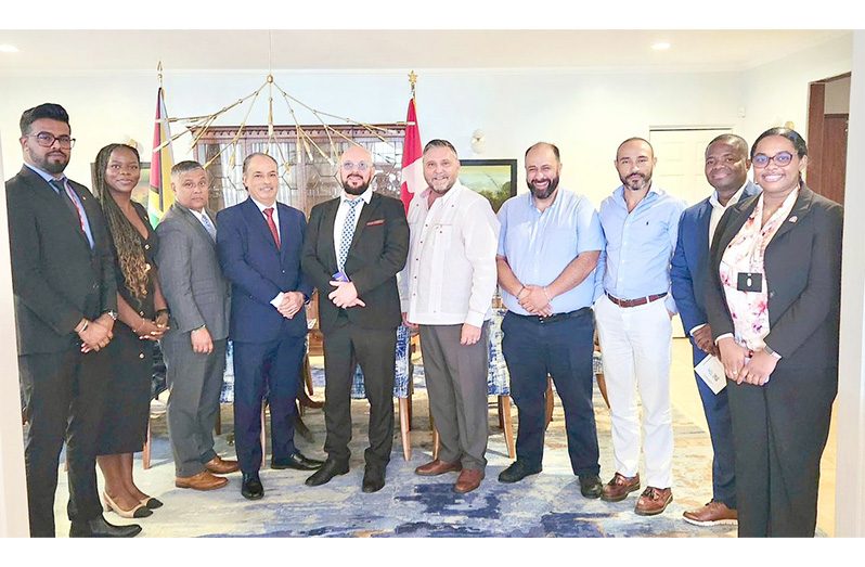 High Commissioner Sébastien Sigouin (in white shirt jack) surrounded by some members of the delegation and from left, the High Commission`s Trade Commissioner, Omesh Balmacoon and Senior Trade Commissioner, Yvanna Nganou