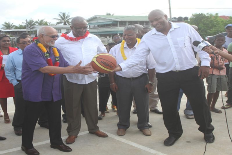 President Donald Ramotar and other Government officials, pose for this Sonell Nelson photograph after the commissioning of the new basketball court at Ithaca.