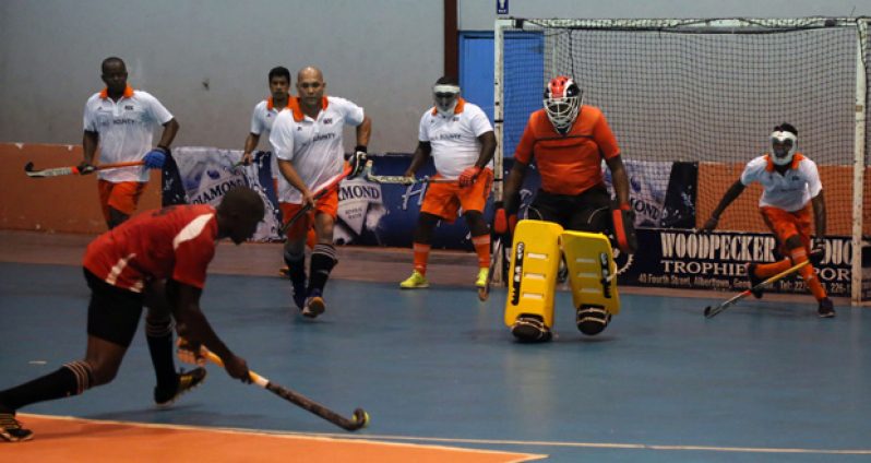 Old Fort’s Aderemi Simon executes a penalty corner strike against the GCC defence