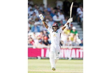 Kavem Hodge celebrates his maiden Test hundred•Jul 19, 2024•Gareth Copley/Getty Images