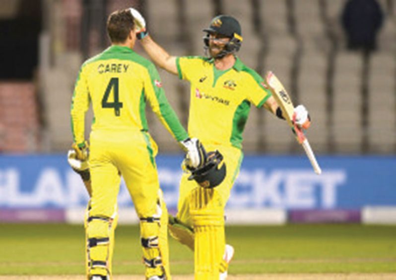 Alex Carey celebrates with fellow centurion and match-winner Glenn Maxwell. (Getty Images)