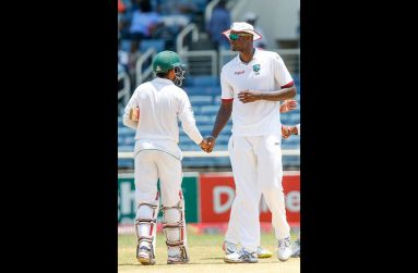 West Indies captain Jason Holder congratulates batsman Babar Azam after Pakistan won the opening Test at Sabina Park on Tuesday. (Photo courtesy WICB Media)