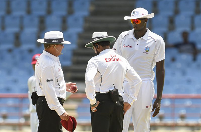 Umpires Ian Gould and Aleem Dar in discussion with Jason Holder about the ball on the fourth day of the second Test, between WINDIES and Sri Lanka on Sunday, June 17, 2018 at the Darren Sammy Cricket Ground