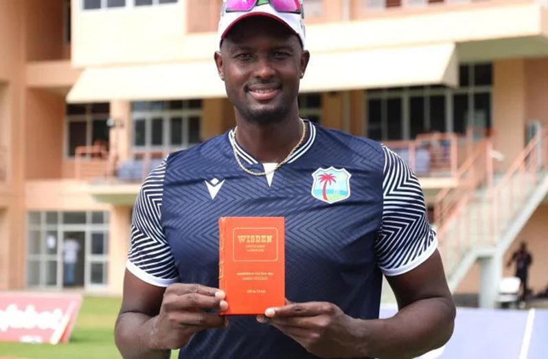 West Indies all-rounder Jason Holder with his special edition, leather-bound Wisden Cricket Almanack (Photo: CWI Media)