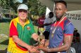 John Lewis Rugby 7’s MVP, Police Falcons Lionel Holder collecting trophy from former National rugger Kit Nascimento