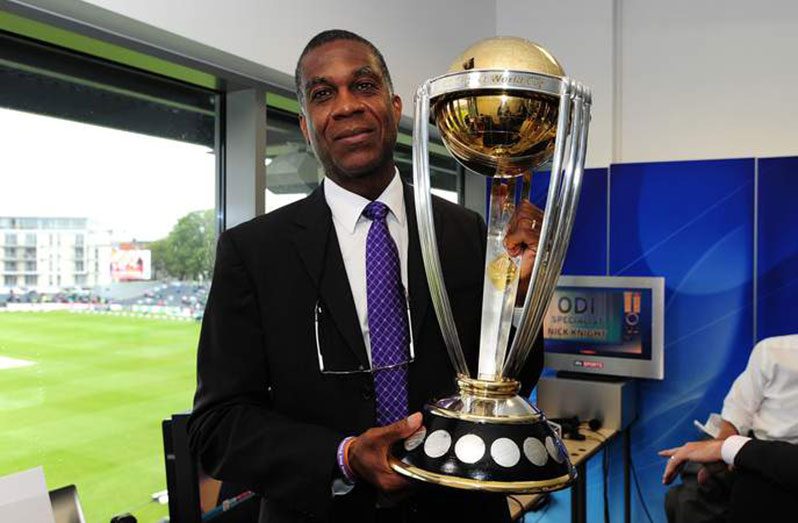 Michael Holding poses with the prestigious trophy.