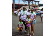 Vanessa Ram and her family travelled all the way from Vreed-en-Hoop, West Bank Demerara, so her children could fully experience the joy of Phagwah (Shaniya Harding photo)