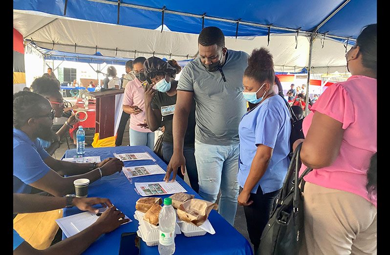 Residents engaging personnel of the Housing and Water Ministry on Tuesday  
