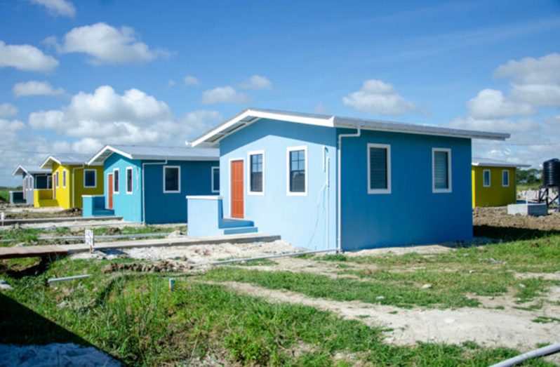 Nine families who were previously squatting along the sea defence reserve at Annandale, East Coast Demerara (ECD) receive the keys to their new houses