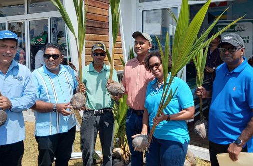Minister of Agriculture, Zulfikar Mustapha,( Second from left) and Ricky Roopchand, General Manager of Hope Coconut Industries Limited (third from left) with persons in the agriculture sector
