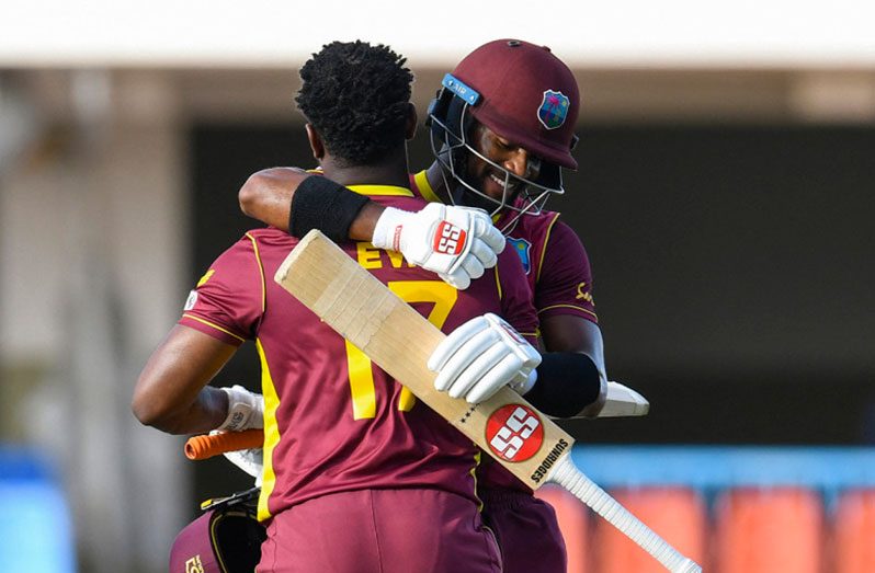 Shai Hope congratulates Evin Lewis on his century.  (AFP/Getty Images)
