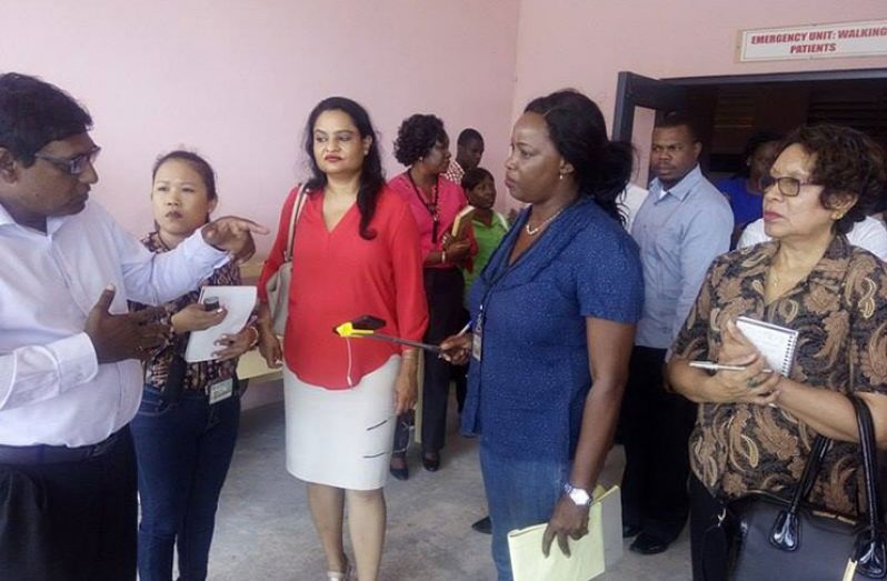 CEO of the Linden Hospital Complex, Dr Farouk Riyasat, in discussion with Parliamentary Sectoral Committee Chairman, Dr Vindhya Persaud (centre) and member Minister within the Ministry of Indigenous People’s Affairs, Ms Valerie Garrido-Lowe (left) and two staff members of the National Assembly