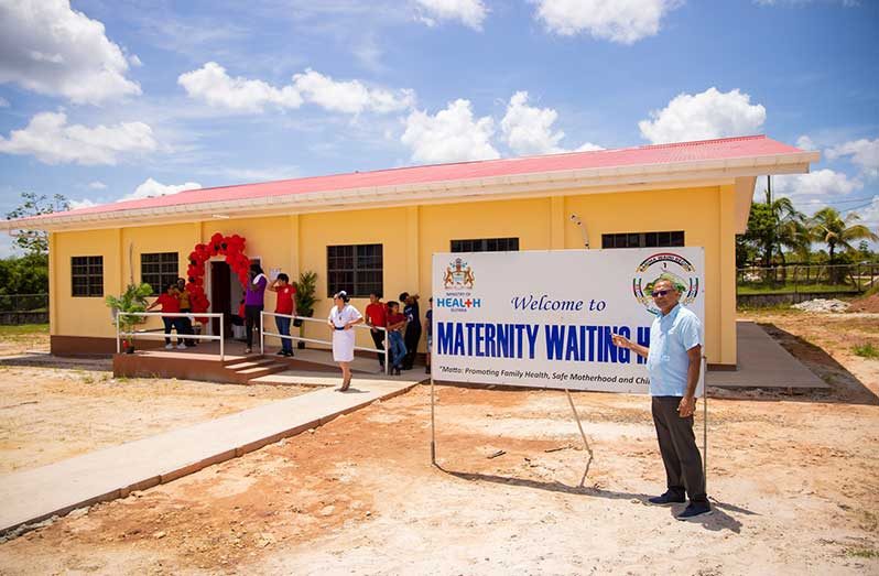 Minister of Health Dr. Frank Anthony standing in front of the Port Kaituma Hospital’s new maternal waiting home