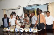 Top Brandz Sales and Marketing Manager  Pratima Prashnajeet and Petra Co-Director Troy Mendonca hold a replica of the championship trophy in the presence of GFF president Forde (far left), GFA vice-president Aaron Fraser (3rd from right) and with other representatives.
