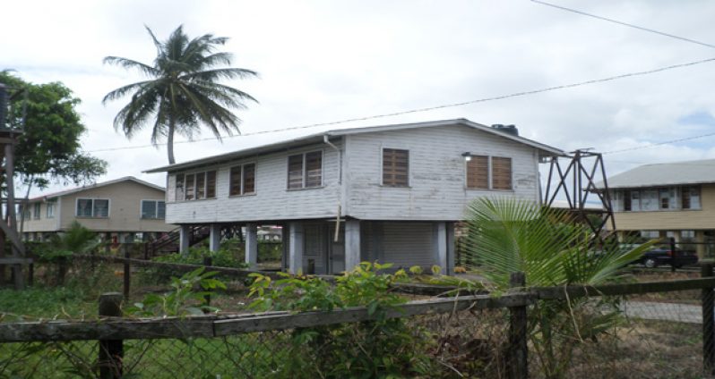 The house at which the robber was caught exiting through the window