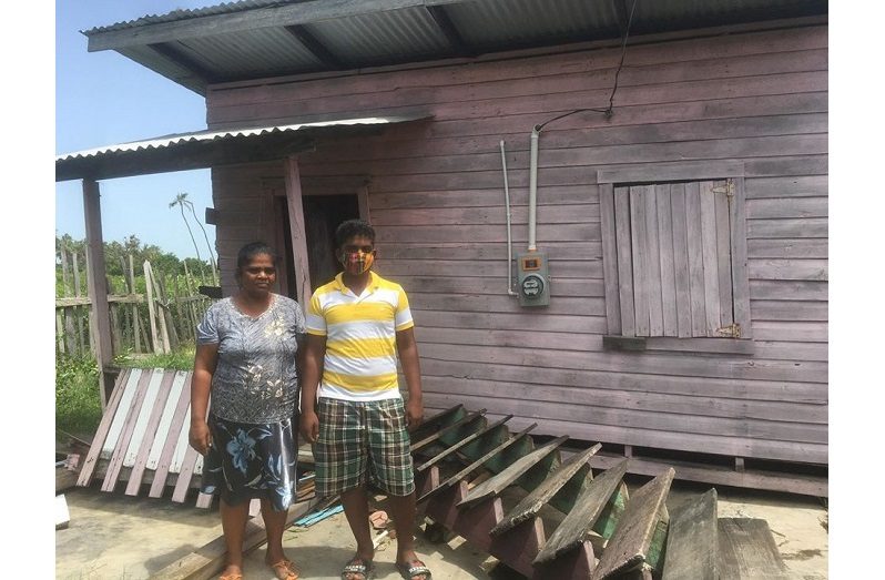 Roopranie Latchminarine and her Romel
Richard stand in front of their house that fell to the ground on Wednesday morning amid heavy winds. (Nafeeza Yahya photo)