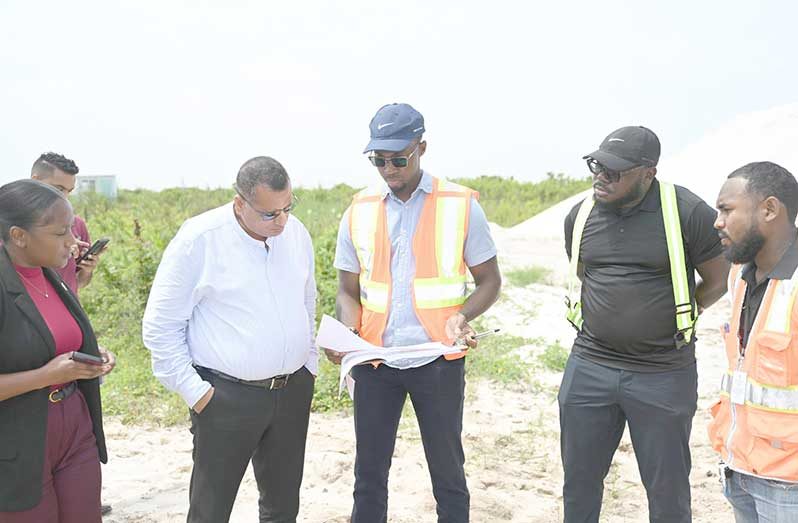 Housing Minister Collin Croal accompanied by engineers, engineering technicians, clerks of works, and contractors, conducted a site inspection on Monday to assess progress and engage contractors responsible for delayed works within the development