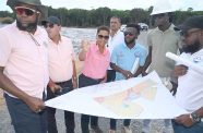 Housing Ministers of Housing, Collin Croal and Vanessa Benn, flanked by Ministry of Housing officials, making decisions at Wismar Housing Development, Phase One, in Region Ten