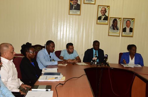 Seated from right are: Operations Director, Denise King-Tudor; CEO, Lelon Saul; acting Projects Director, Omar Narine; Community Development Director, Gladwin Charles; and Chief Development Officer, Germane Stuart. (Photo by Adrian Narine)
