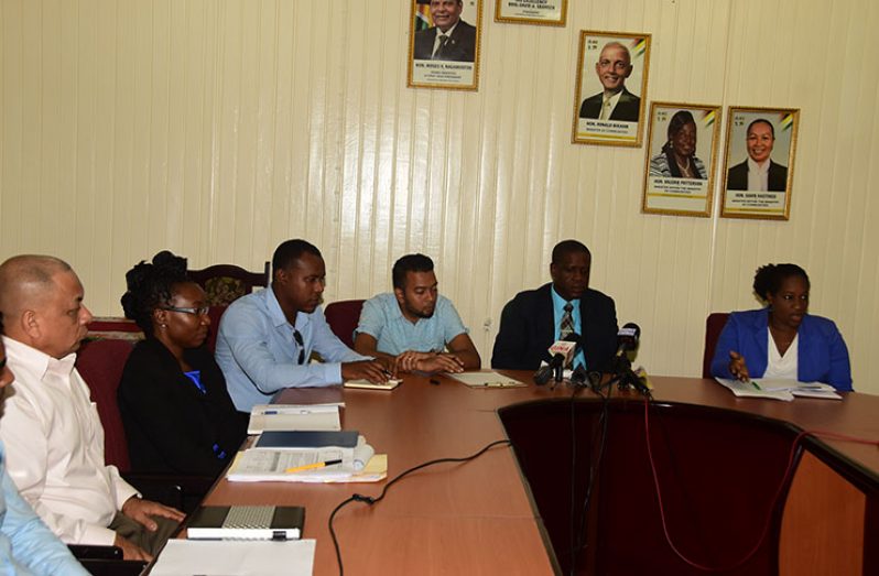 Seated from right are: Operations Director, Denise King-Tudor; CEO, Lelon Saul; acting Projects Director, Omar Narine; Community Development Director, Gladwin Charles; and Chief Development Officer, Germane Stuart. (Photo by Adrian Narine)