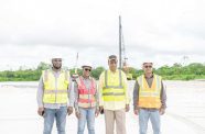 :  Minister of Public Works, Bishop Juan Edghill (second from right), the MOPW Project Manager for the Government Office Complex, Ms. Carissa Goodings, Aubrey Changlee, the team leader of VIKAB Guyana Inc (extreme right), and Mr. Chaman Basdeo, the Head of Operations at Caribbean Green Infrastructure Inc. at the construction site of the government complex at Houston, East Bank Demerara (Delano Williams photo)