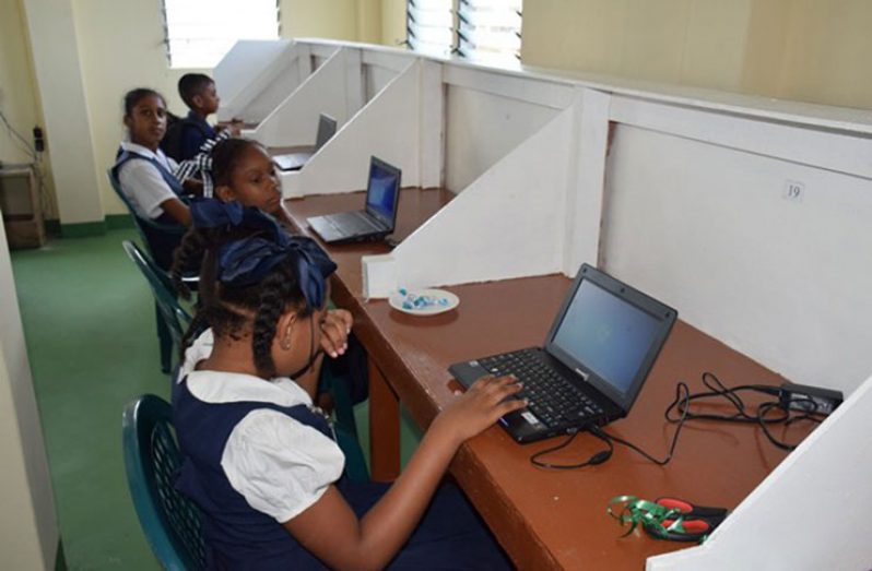 Children putting the ICT Hub at Parika to good use