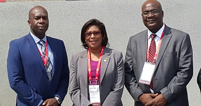 Minister of Public Telecommunications Minister Cathy Hughes (center), Floyd Levi, Head of the E-Government Unit (left) and Clement Henry, Manager of the Citizen Security Strengthening project, Ministry of Public Security.