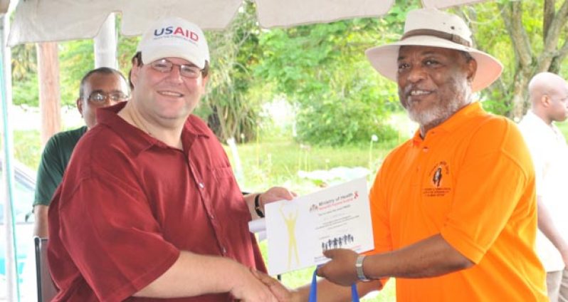 U.S. Embassy Chargé d’Affaires, Bryan Hunt and Prime Minister Samuel Hinds during the recent World AIDS Day Walk