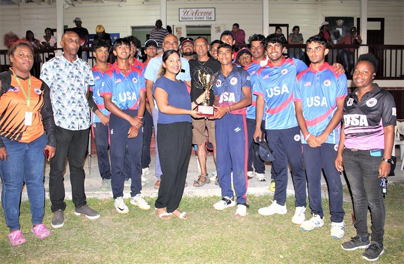 USA Tri-State captain, Bolisette, is presented with the winner’s trophy by Ms. Emma Hussain, daughter of Ramesh Sunich (Sean Devers photo)