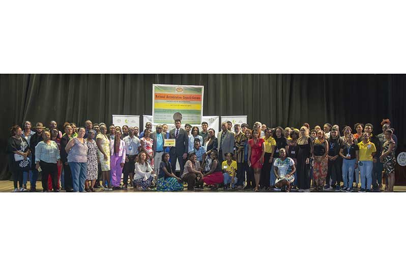 Minister of Culture, Youth and Sport, Charles Ramson (centre)  flanked by key officials, and students and lecturers of the ICA (Japheth Savory photo)