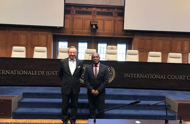Registrar of the International Court of Justice, Philippe Couvreur (left) and Vice President and Minister of Foreign Affairs, Carl Greenidge (right)