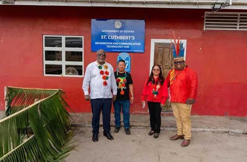Prime Minister, Brigadier (Ret’d) Mark Phillips (left) and Minister within the Ministry of Local Government and Regional Development, Pauline Sukhai (third from left), in front of the St Cuthbert’s Mission ICT hub