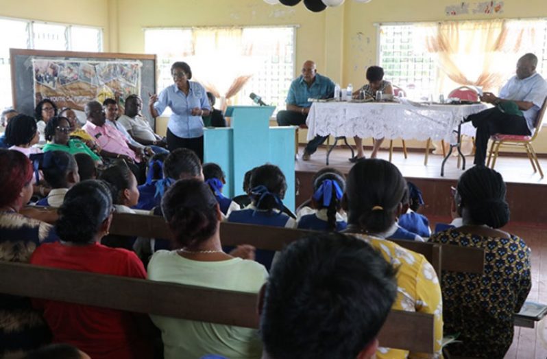 Minister of Telecommunications, Catherine Hughes, speaks with residents of Itaballi during a community outreach on Wednesday. Looking on at the head table is Chief Executive Officer of the Guyana Water Incorporated, Dr. Richard Van West-Charles; Minister of Social Protection, Amna Ally and Director General of the Ministry of the Presidency, Joseph Harmon.