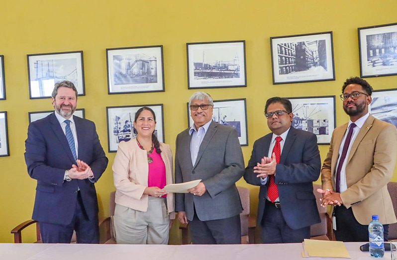 From left to right: Aito Ezcurra, Division Chief of Corporates at IDB Invest, Lorena Solorzano Salazar, Country Representative in Guyana at IDB Group, Komal Samaroo, DDL Group Chairman, Dr Ashni Singh, Senior Finance Minister and Mark Peters, Investment Officer at IDB Invest