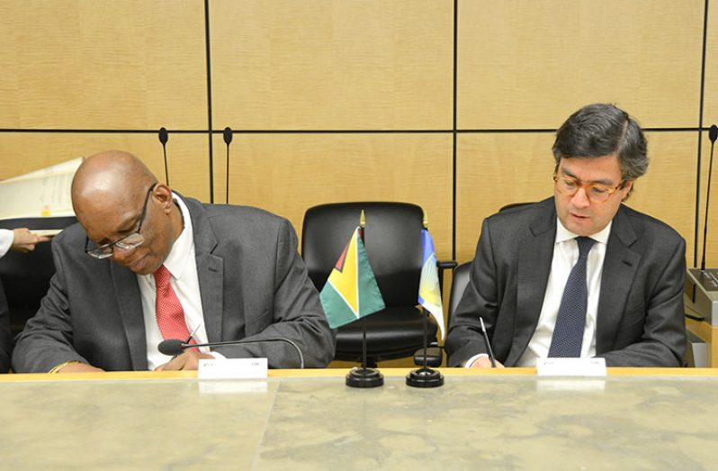 Finance Minister Winston Jordan and IDB President, Luis Alberto Moreno, signing the loan agreements at the headquarters of the IDB in Washington, D.C. on Tuesday