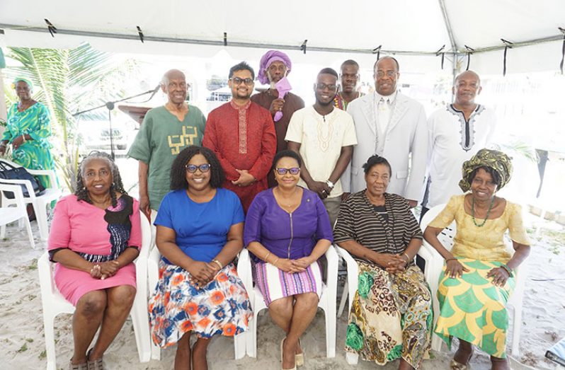 in photo seated from L to R are Olive Sampson, Minister of Foreign Affairs Dr Karen Cummings, Minister of Public Health the Hon Volda Lawrence, Gem Rohlehr and Penda Guyan.   Standing are former Mayor of Georgetown Hamilton Green, present Mayor of Georgetown, His Worship Ubraj Narine, a member of the Pan African movement, medical student Nicholas Elliot, another Pan African movement, Albert Bentick and Leon Mc Donald.